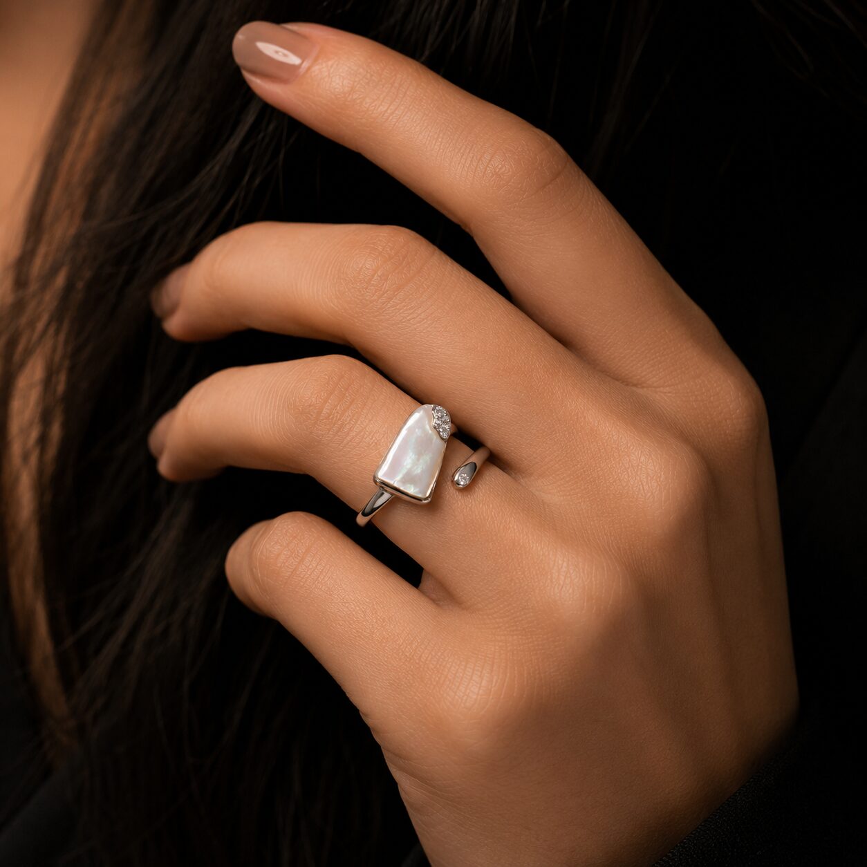 Add a touch of timeless beauty to your jewellery collection with this beautifully crafted Pearl Aura Adjustable Ring for women. Inspired by the elegance and purity of pearls, this ring features a graceful contemporary design that perfectly blends classic charm with modern sophistication. The premium rhodium finish enhances its luxurious shine while giving it a refined and polished look suitable for every occasion. Designed with a free-size adjustable fit, it offers maximum comfort for all-day wear. Whether paired with casual outfits, office wear, festive attire, or elegant evening looks, this ring adds a soft and graceful statement to your overall style.